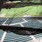 Debris netting provides safety for the public at a stadium.