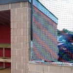 Barrier netting for a Little League Baseball field.