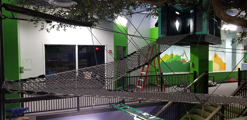 A climbing net installation in a children's museum.