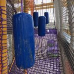 Obstacles used in a netted play structure