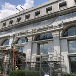 A facade safety netting system being installed on an historic building during reconstruction.
