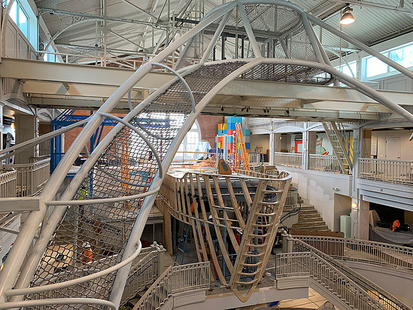 A ship being constructed in a children's museum.