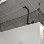 Barrier netting for an elevated storage or work area.