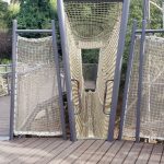 A netted rope bridge at a children's museum.