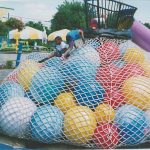 Giant balls in a climbing net bag.
