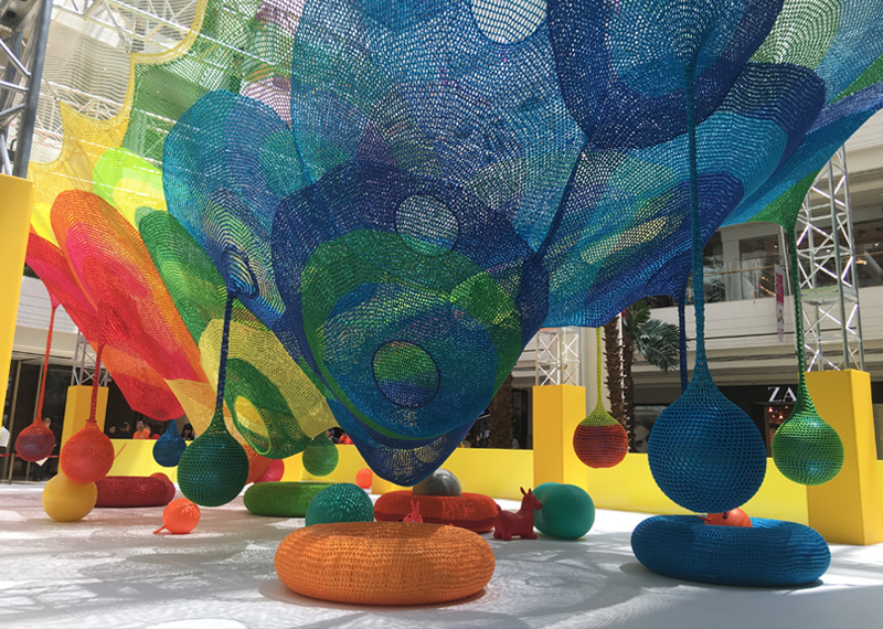 Colorful and  sculptural netting in a public space at a mall.