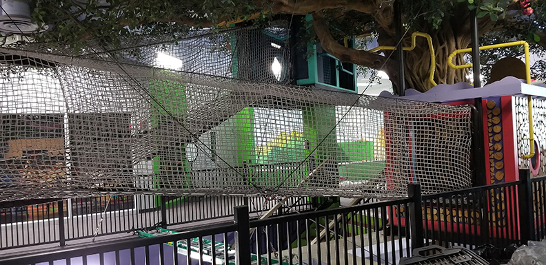 An elevated rope bridge in The Building for Kids children's learning center