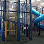 A play structure with a slide attached.