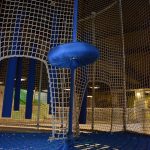 A netted play area for children.
